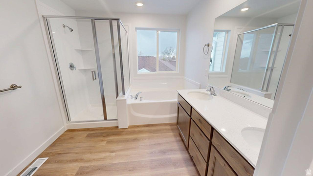 777 Pheasantbrook Drive, Unit 2B Centerville, UT 84014 - Photo 11 of 42 Bathroom featuring a double vanity with stone-finish countertop, wood-finish cabinetry, and undermount sinks