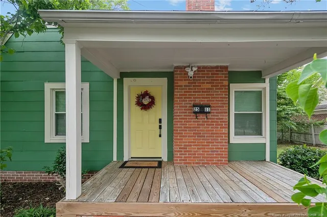 a view of outdoor space and deck front of house