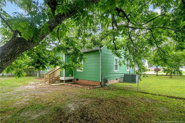 a view of backyard with green space