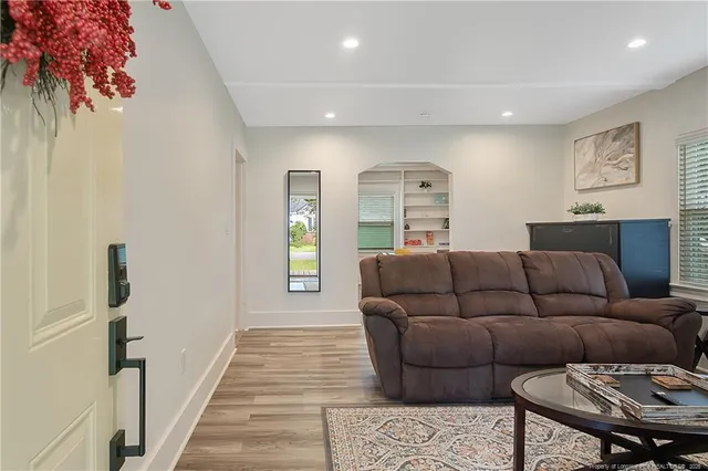 a living room with furniture and a rug