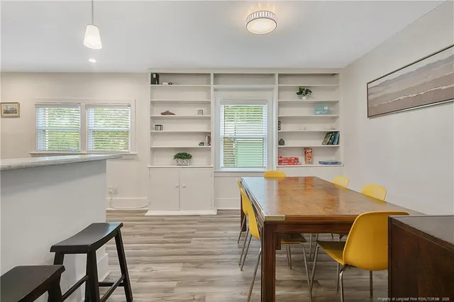 a workspace with furniture and window