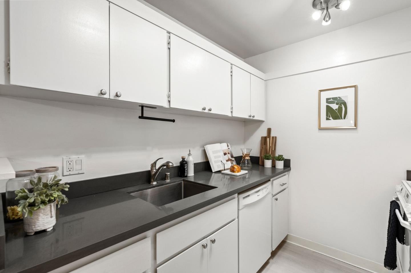 500 West Middlefield Road, Unit 101 Mountain View, CA 94043 - Photo 12 of 37 a kitchen with stainless steel appliances a sink a window and cabinets