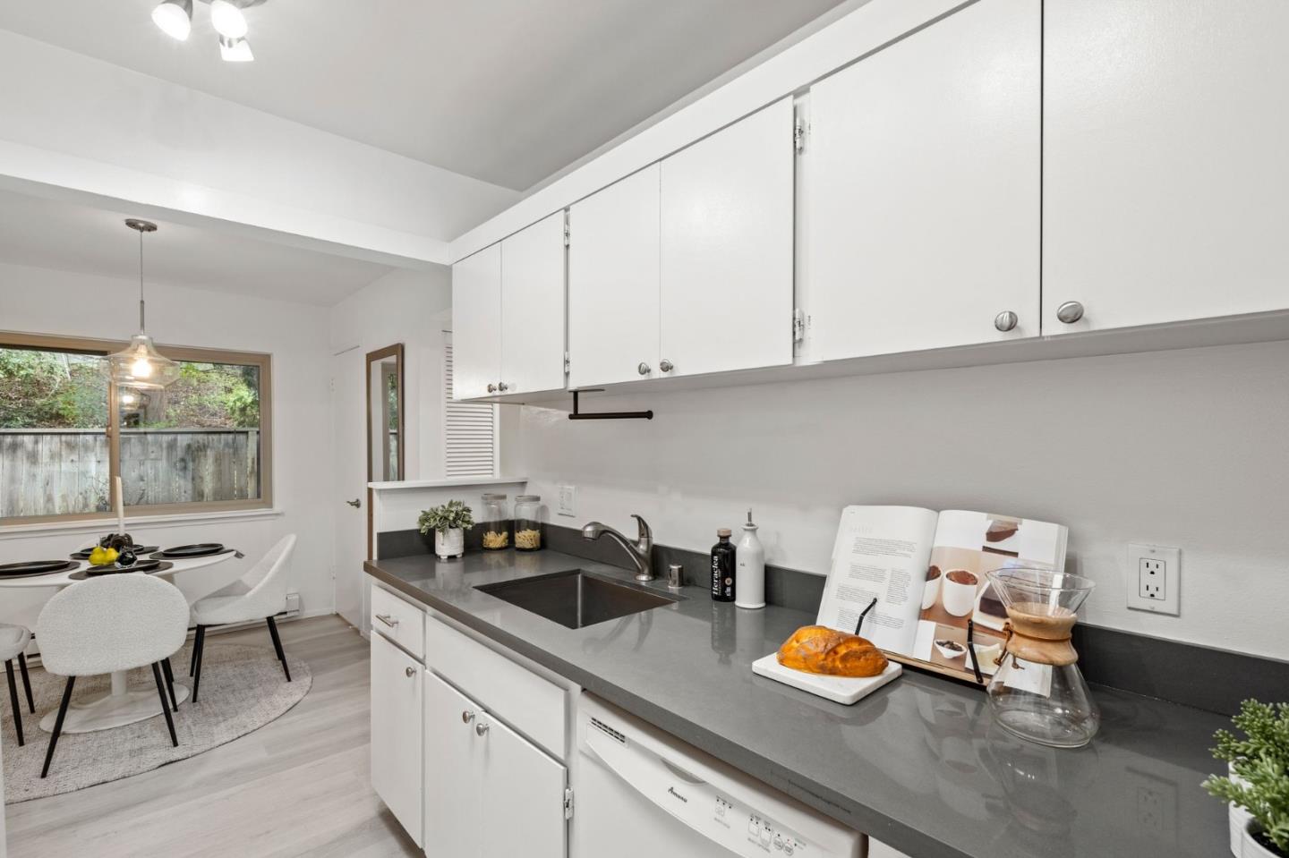 500 West Middlefield Road, Unit 101 Mountain View, CA 94043 - Photo 14 of 37 a kitchen with a sink and cabinets