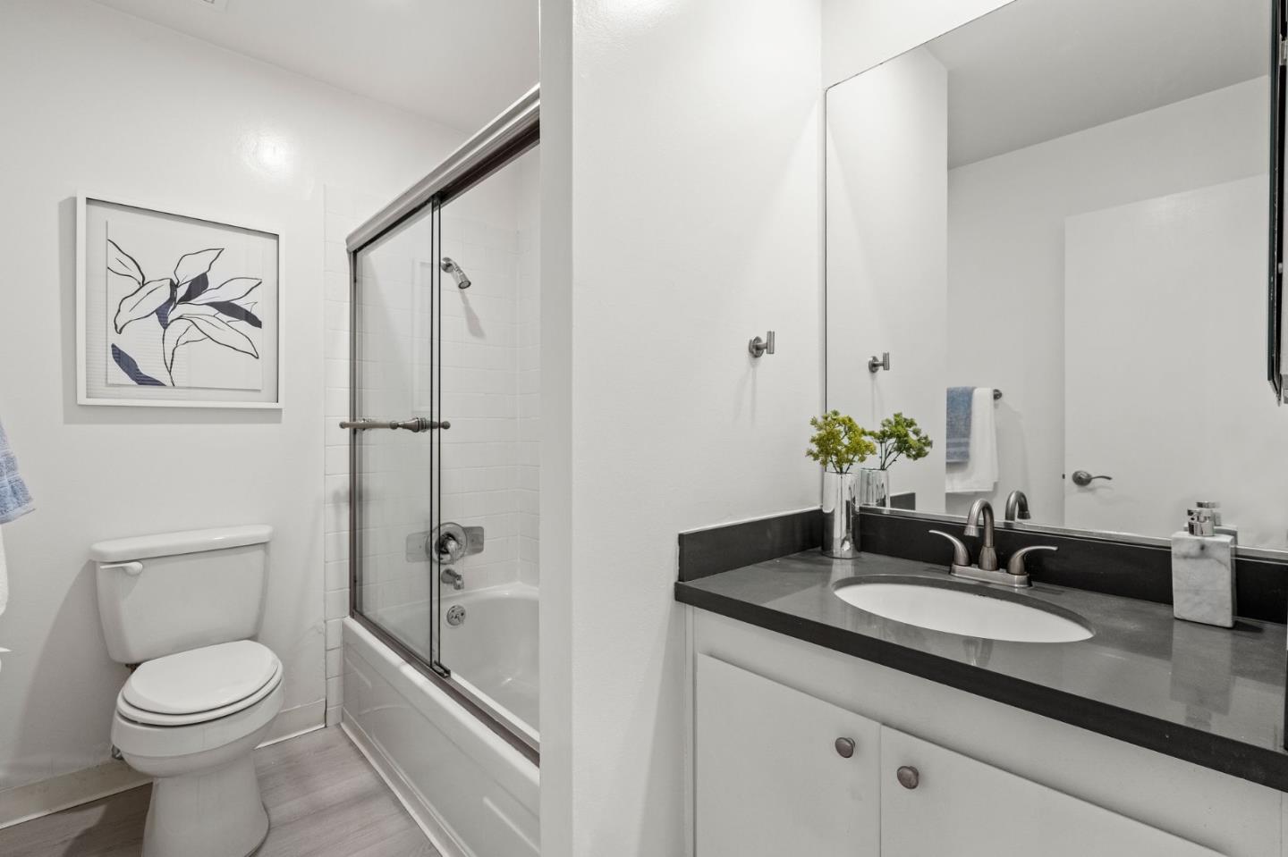 500 West Middlefield Road, Unit 101 Mountain View, CA 94043 - Photo 17 of 37 a bathroom with a granite countertop sink toilet and shower