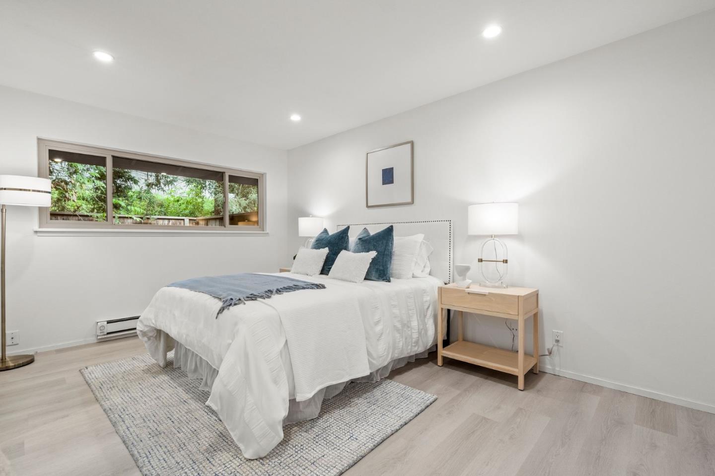 500 West Middlefield Road, Unit 101 Mountain View, CA 94043 - Photo 18 of 37 a bed room with a bed and a chair