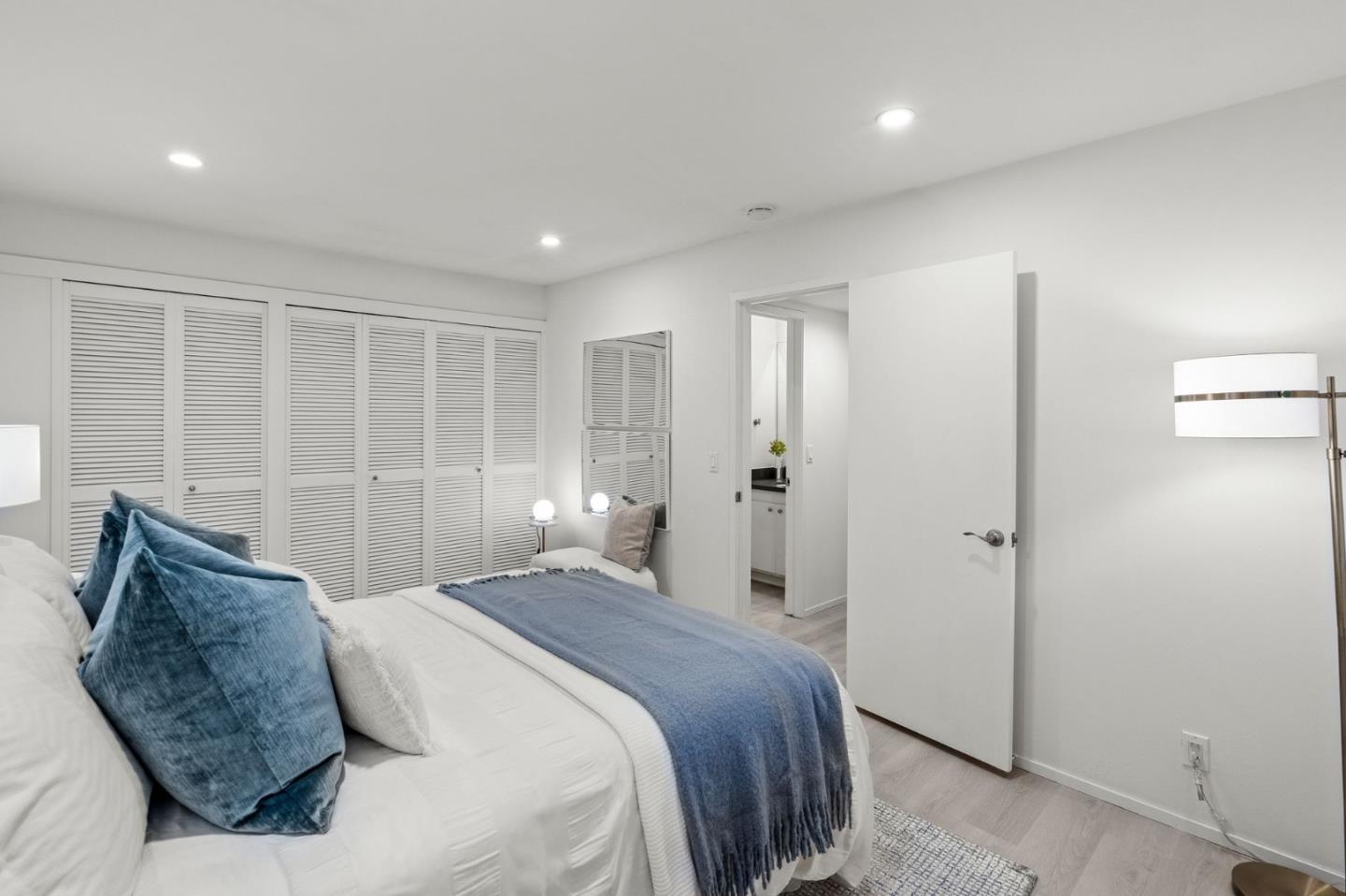 500 West Middlefield Road, Unit 101 Mountain View, CA 94043 - Photo 19 of 37 a bedroom with a large bed and a dresser