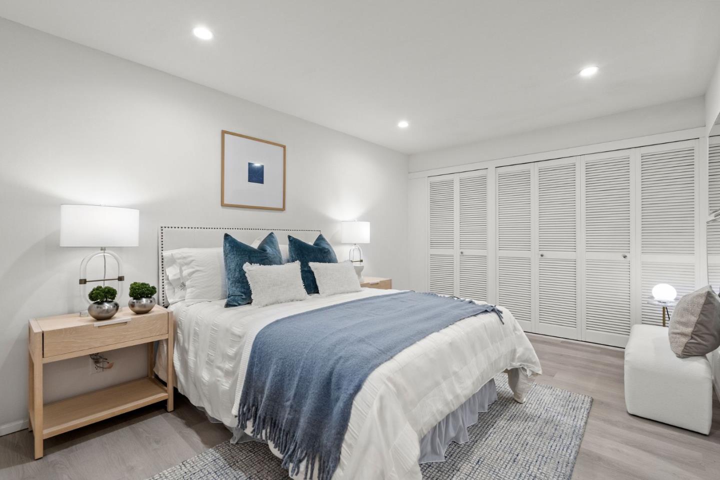 500 West Middlefield Road, Unit 101 Mountain View, CA 94043 - Photo 20 of 37 a spacious bedroom with a bed and a couch