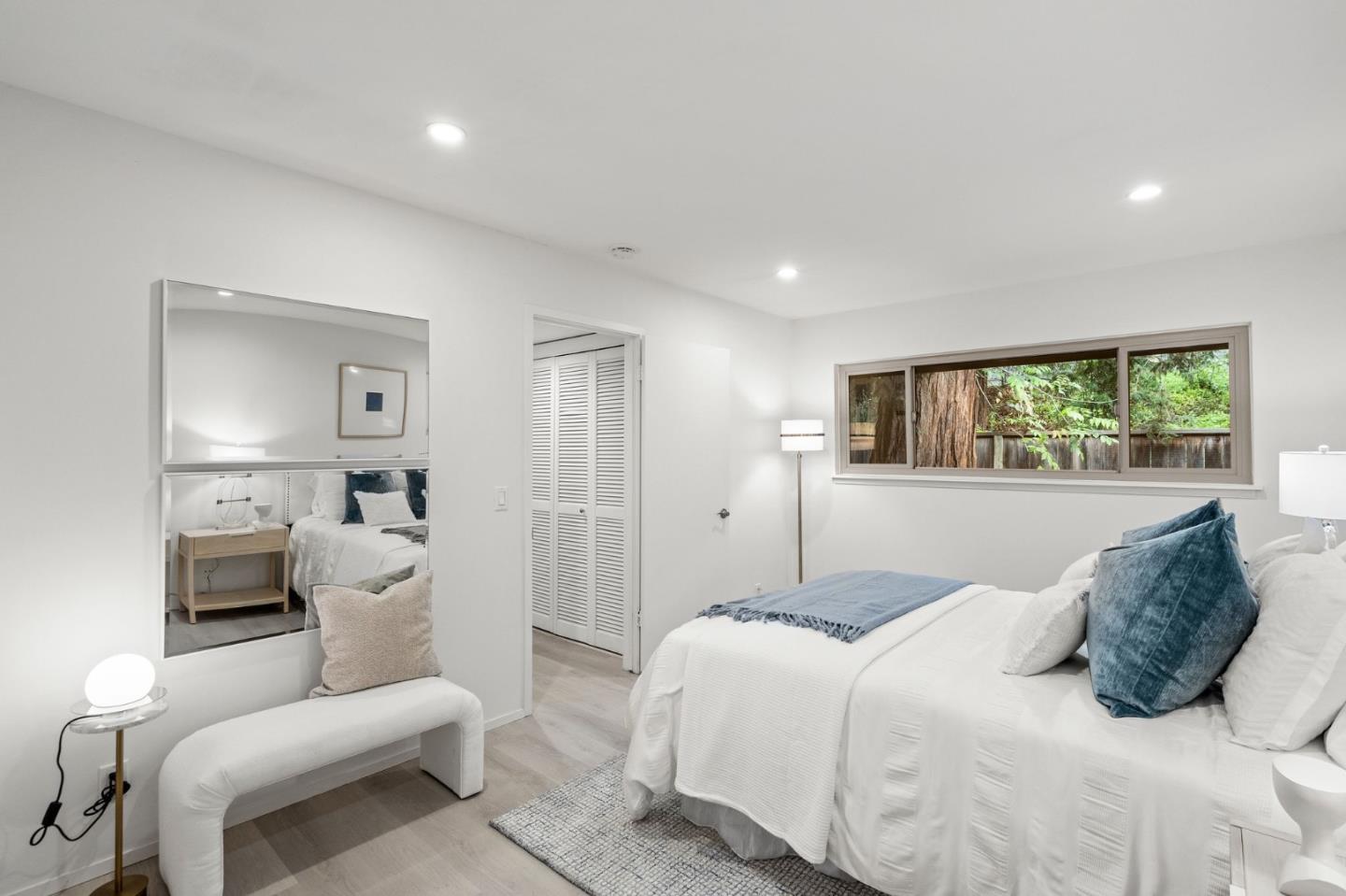 500 West Middlefield Road, Unit 101 Mountain View, CA 94043 - Photo 21 of 37 a bedroom with a large bed and a couch