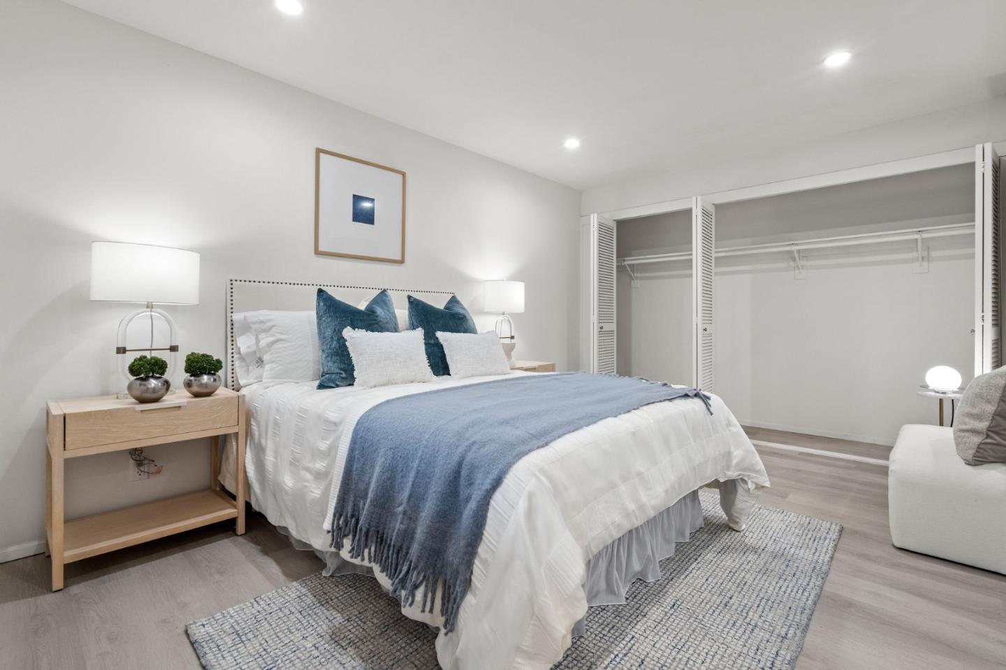 500 West Middlefield Road, Unit 101 Mountain View, CA 94043 - Photo 22 of 37 a bedroom with a bed and a lamp