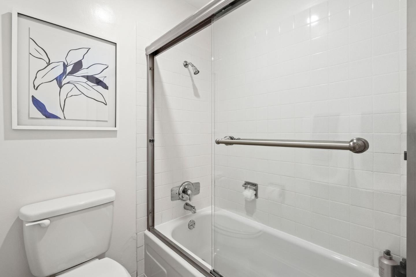500 West Middlefield Road, Unit 101 Mountain View, CA 94043 - Photo 25 of 37 a bath tub sitting next to a white toilet and a shower curtain