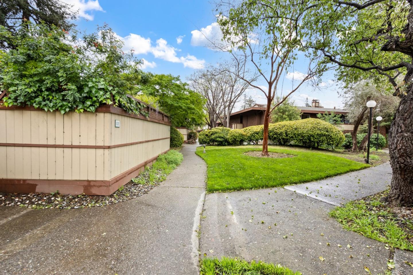 500 West Middlefield Road, Unit 101 Mountain View, CA 94043 - Photo 29 of 37 a view of a garden with a large trees