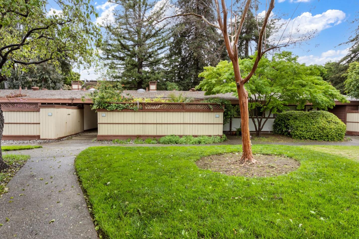 500 West Middlefield Road, Unit 101 Mountain View, CA 94043 - Photo 30 of 37 a view of a garden with a tree