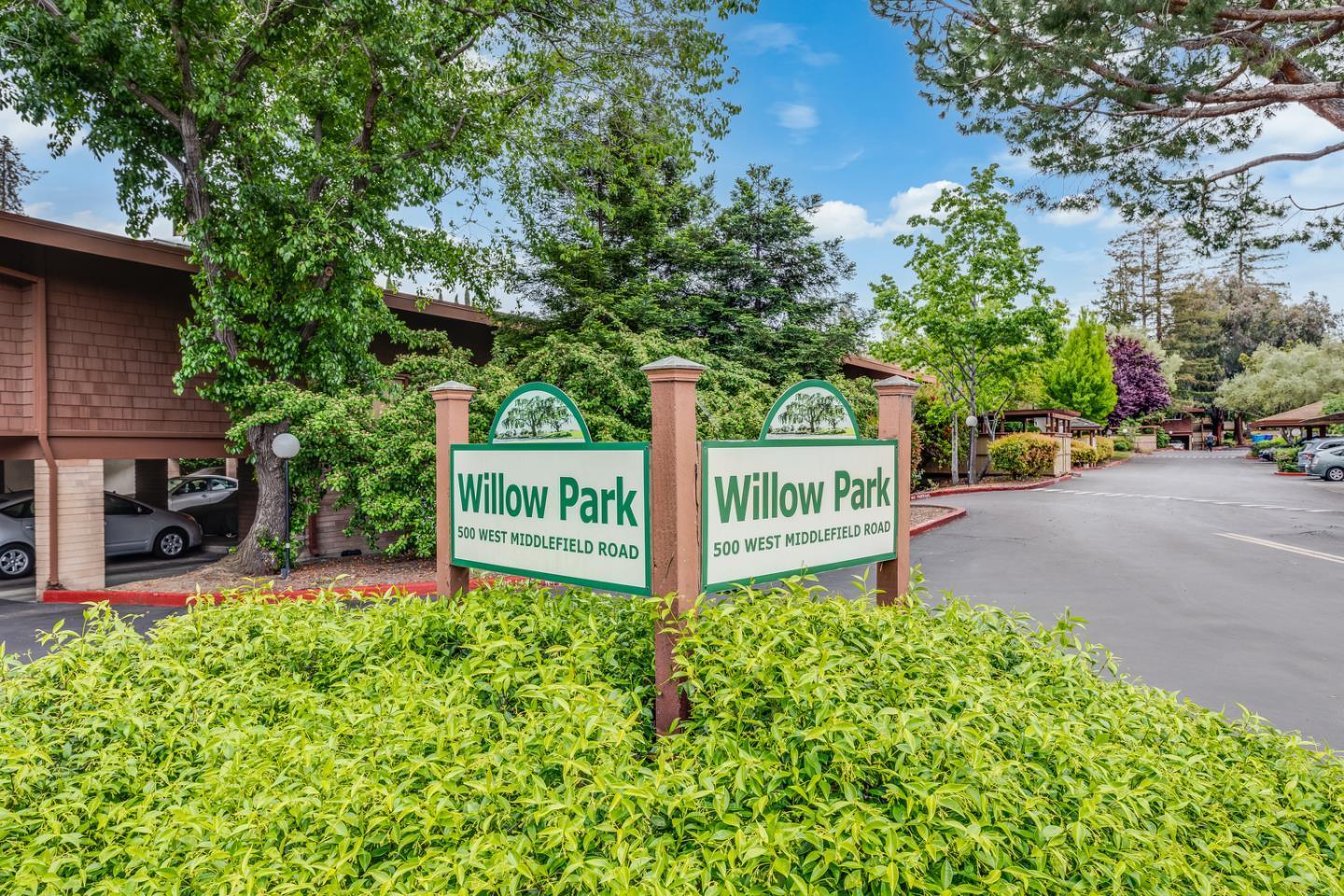 500 West Middlefield Road, Unit 101 Mountain View, CA 94043 - Photo 31 of 37 a view of a street with potted plants and a building