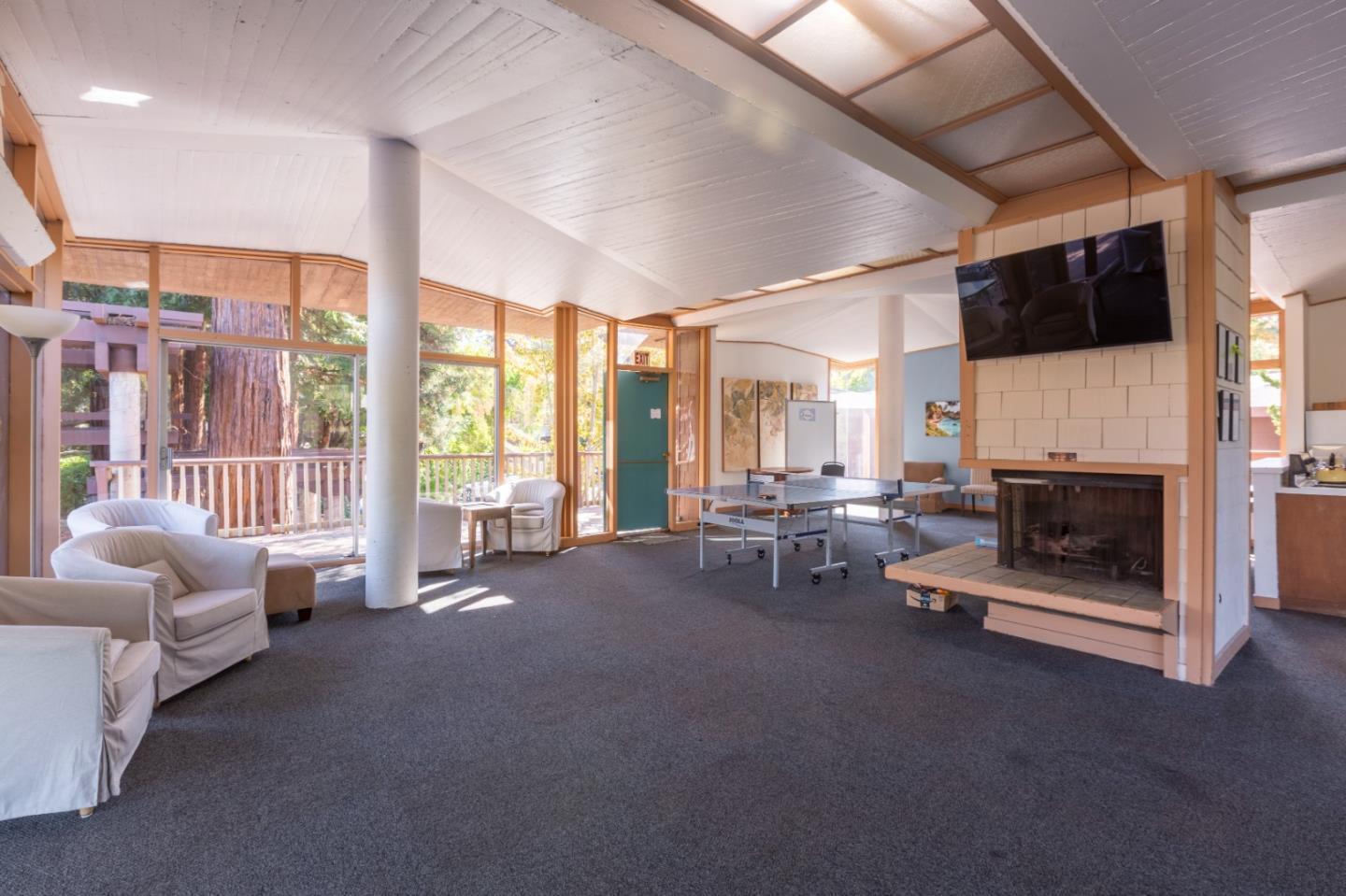 500 West Middlefield Road, Unit 101 Mountain View, CA 94043 - Photo 35 of 37 a living room with furniture and a fireplace