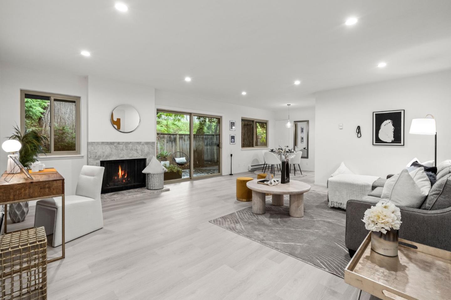 500 West Middlefield Road, Unit 101 Mountain View, CA 94043 - Photo 7 of 37 a living room with furniture a window and a fireplace