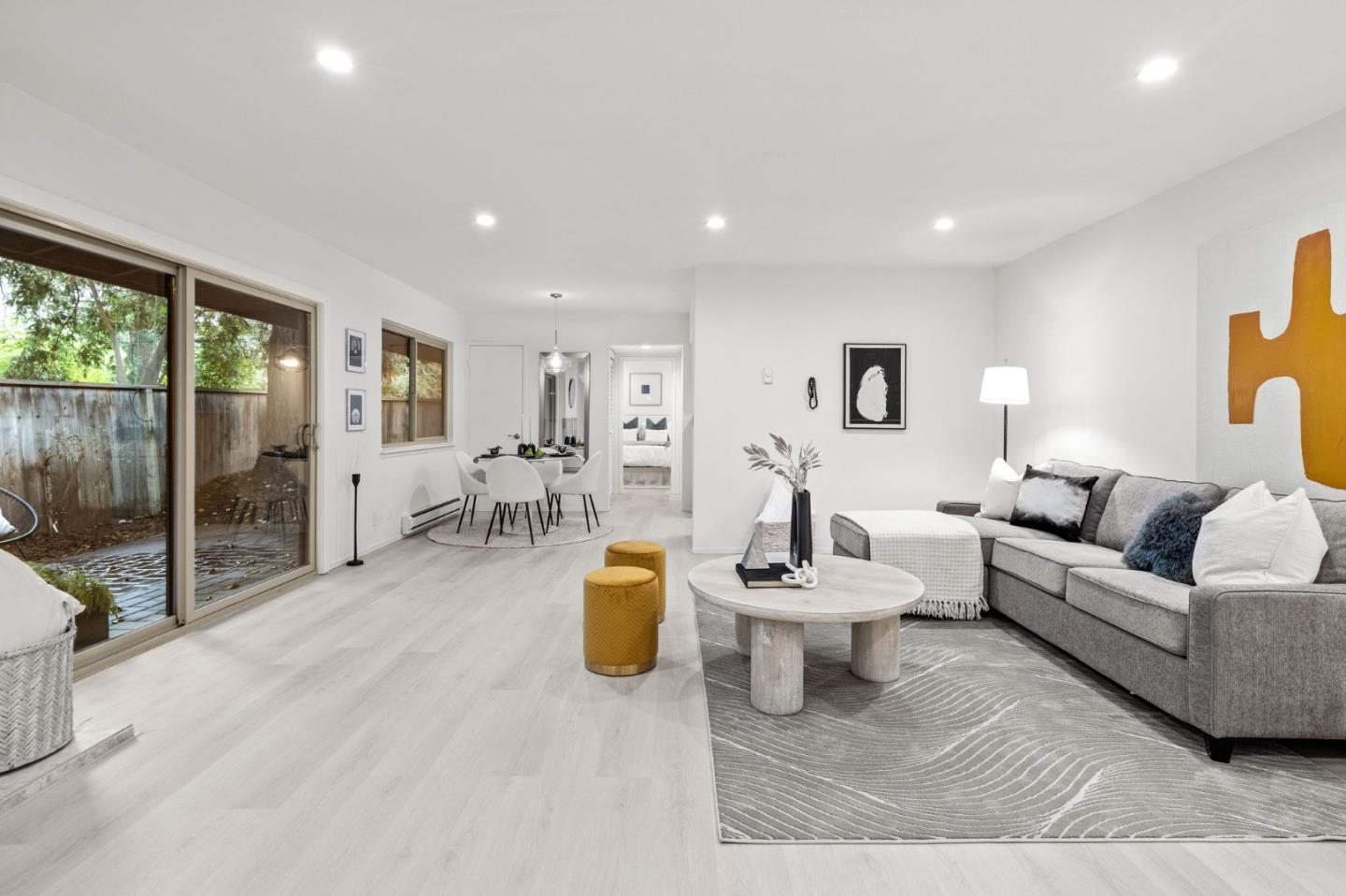 500 West Middlefield Road, Unit 101 Mountain View, CA 94043 - Photo 8 of 37 a living room with furniture and a table