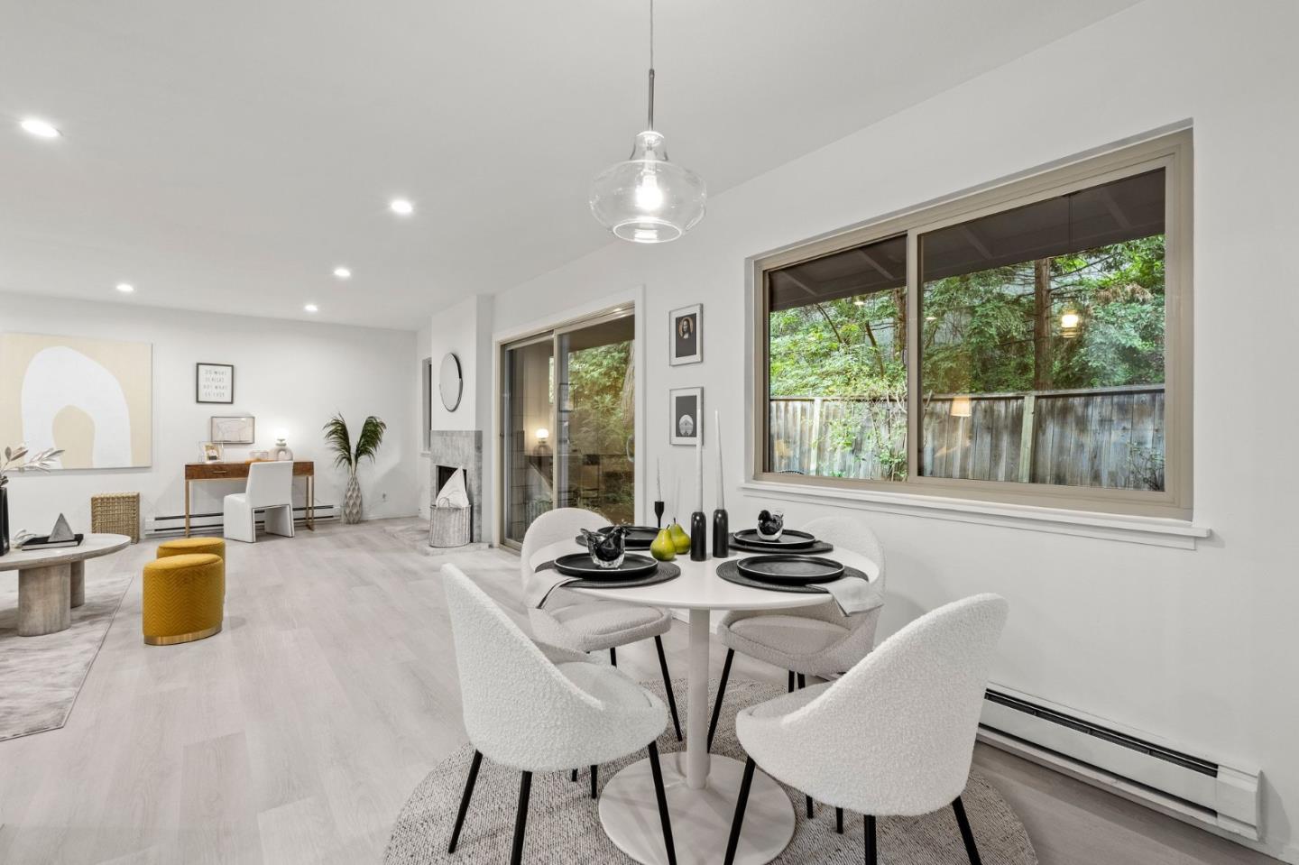 500 West Middlefield Road, Unit 101 Mountain View, CA 94043 - Photo 10 of 37 a dining room with furniture a chandelier and wooden floor