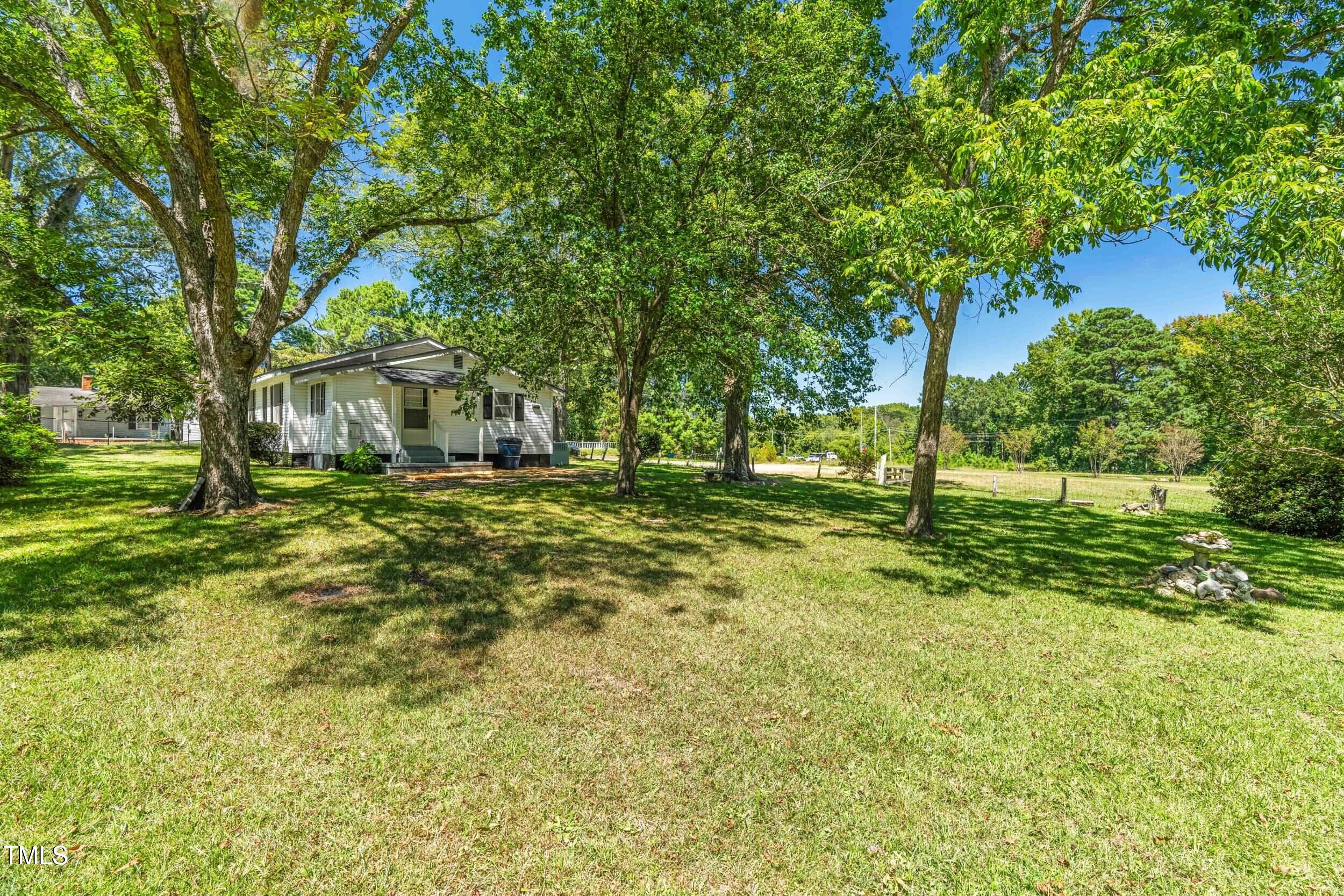 612 North 4th Street Smithfield, NC 27577 - Photo 20 of 22 a view of a yard with a tree