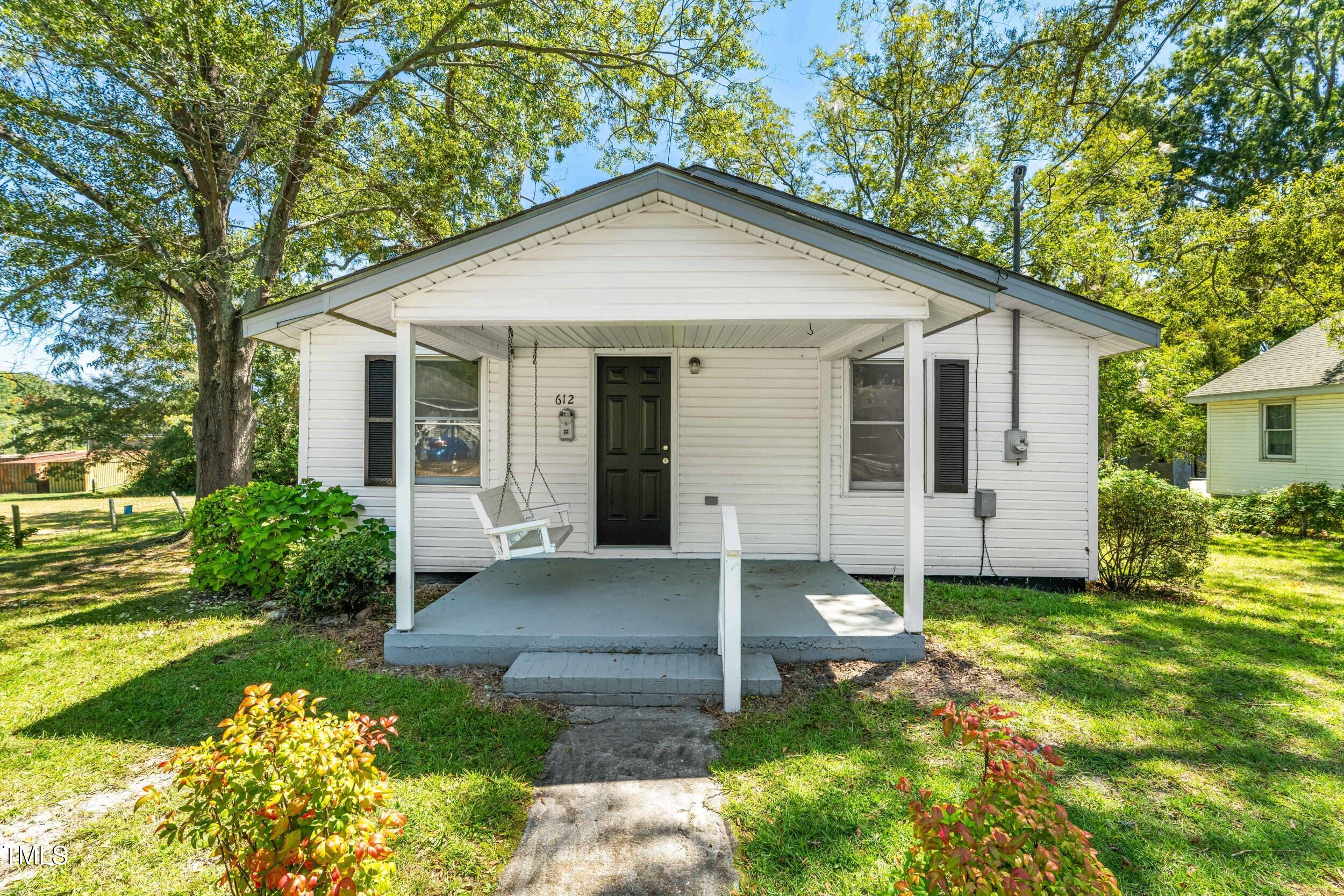 612 North 4th Street Smithfield, NC 27577 - Photo 2 of 22 a front view of a house with a yard