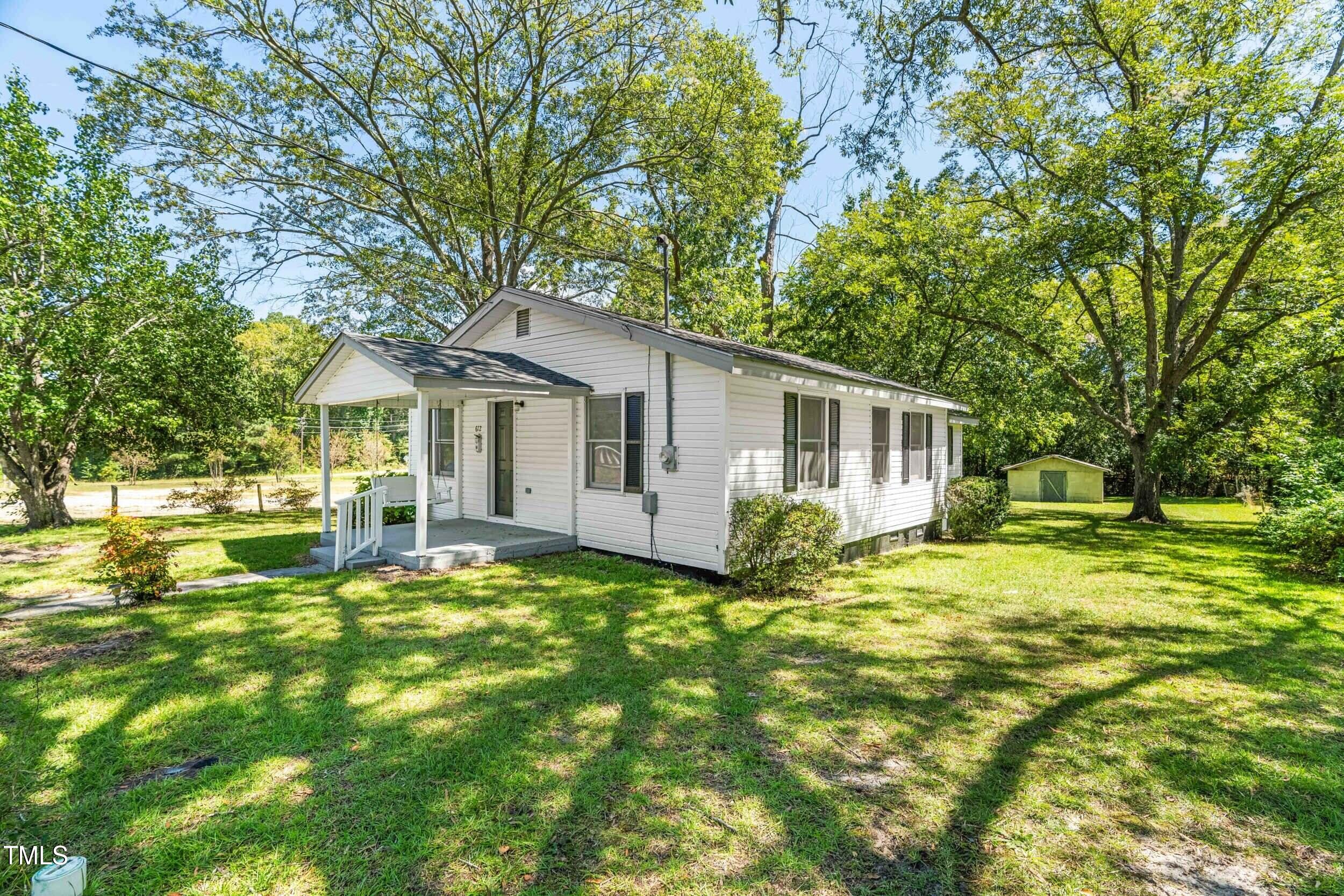 612 North 4th Street Smithfield, NC 27577 - Photo 3 of 22 a view of a house with a yard and sitting area