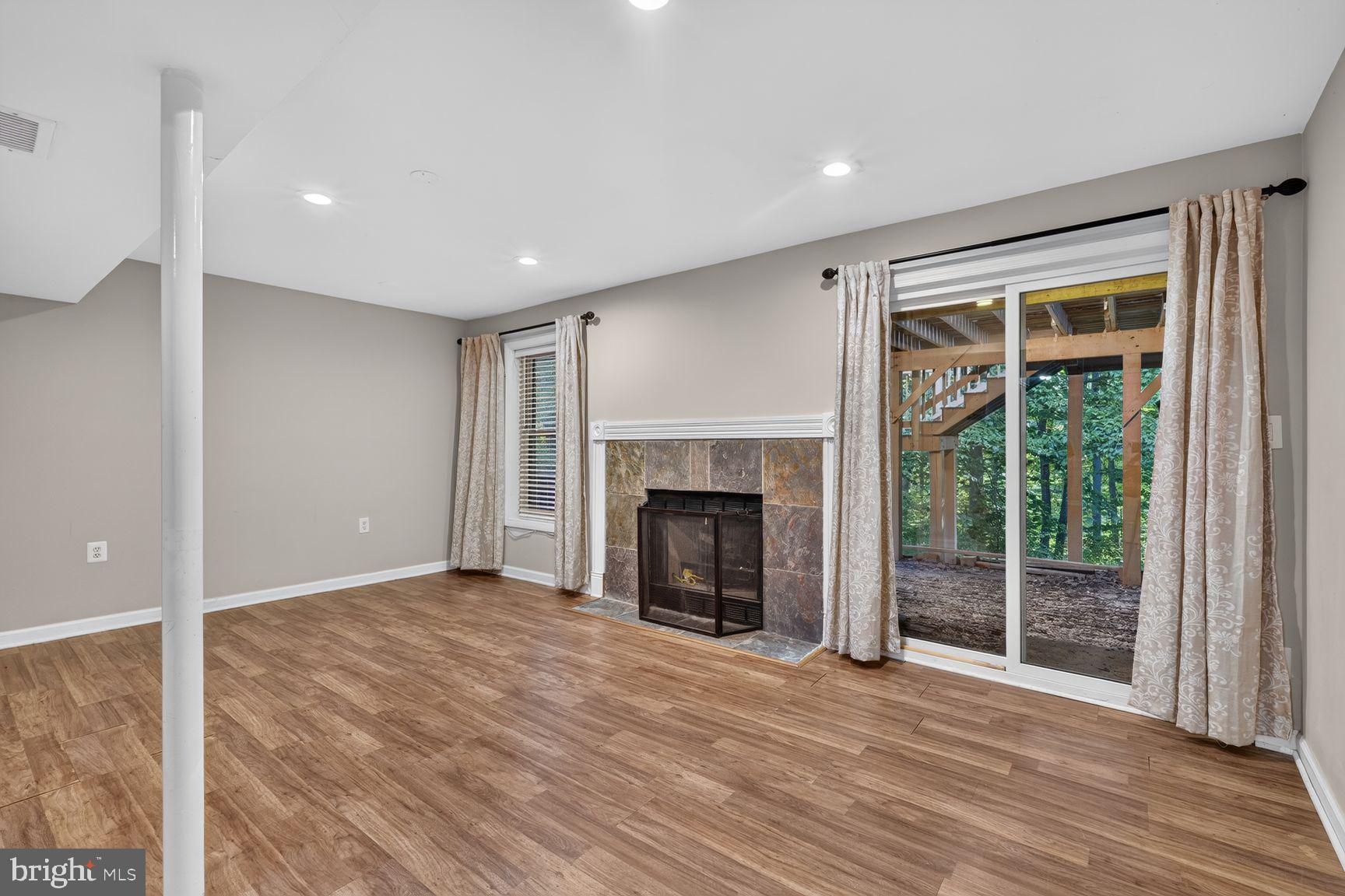 6223 Rathlin Drive Springfield, VA 22152 - Photo 21 of 27 Rec room w/ propane fireplace and yard access