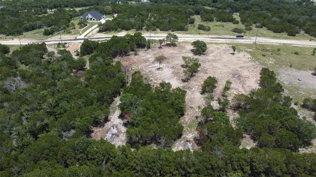 an aerial view of house with yard