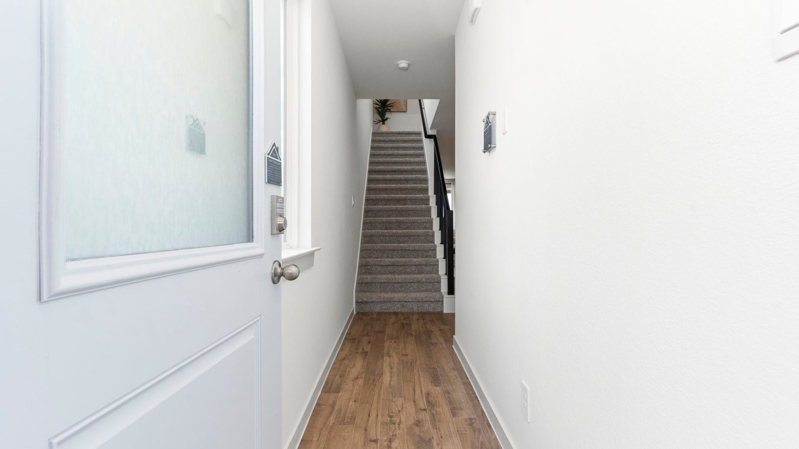 3531 Blue Mockingbird Street Katy, TX 77494 - Photo 3 of 41 a view of a hallway with wooden floor and entryway