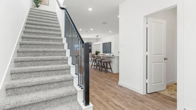 a view of entryway and hall with wooden floor