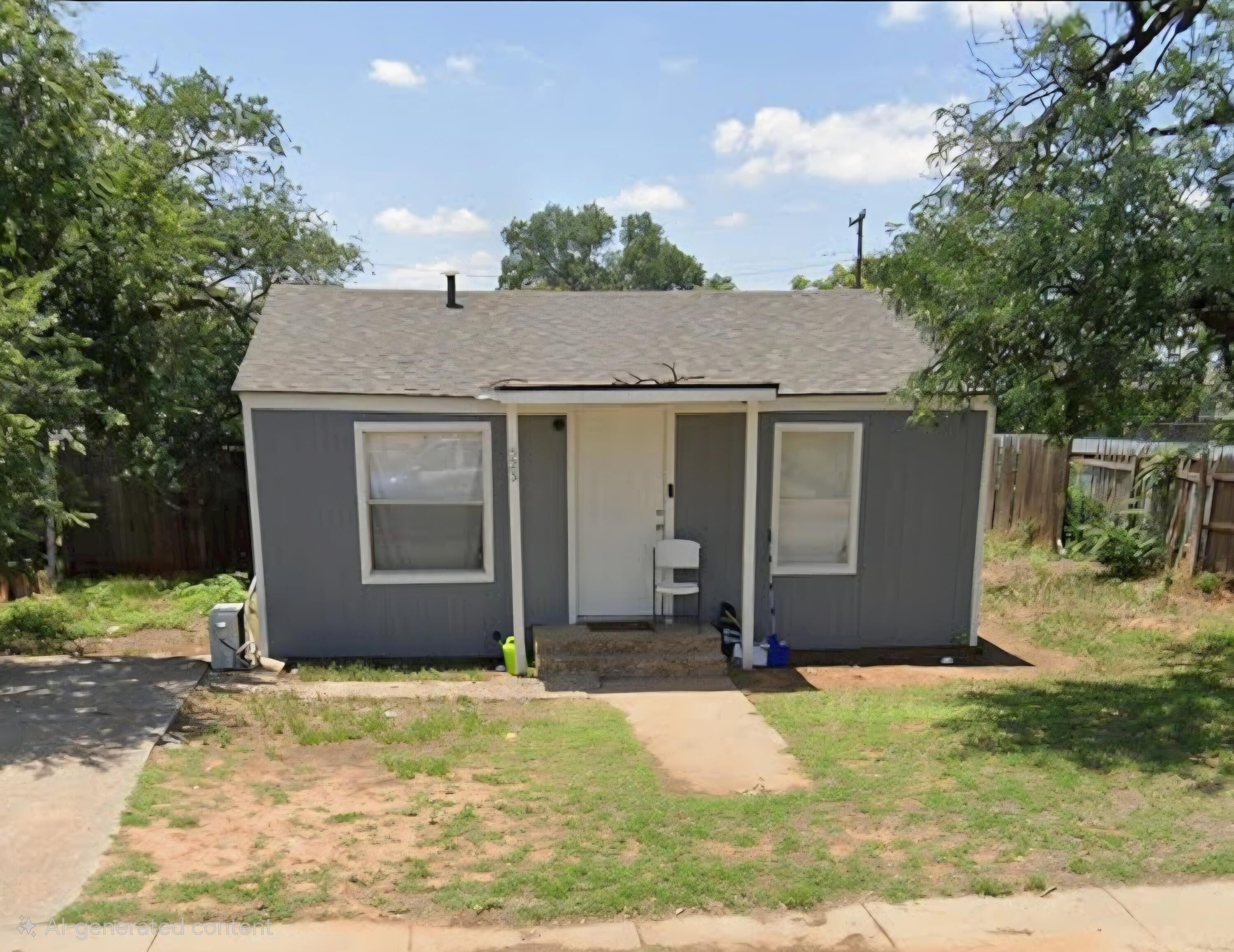 523 39th Street Lubbock, TX 79404 - Photo 1 of 1 a view of a white house with a yard plants and large tree