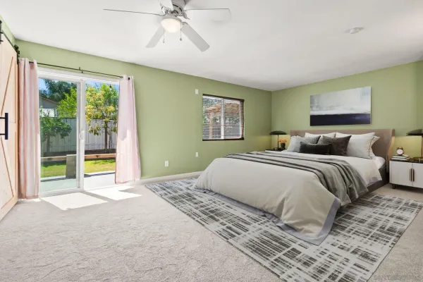 a bedroom with a large bed and a window