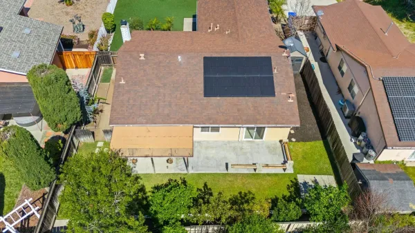 an aerial view of a house with garden space sitting space and swimming pool