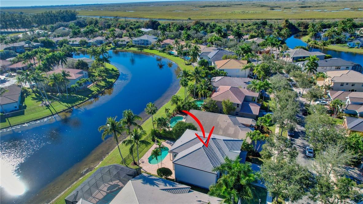 11750 Bayfield Drive Boca Raton, FL 33498 - Photo 11 of 70 an aerial view of a house with a lake view