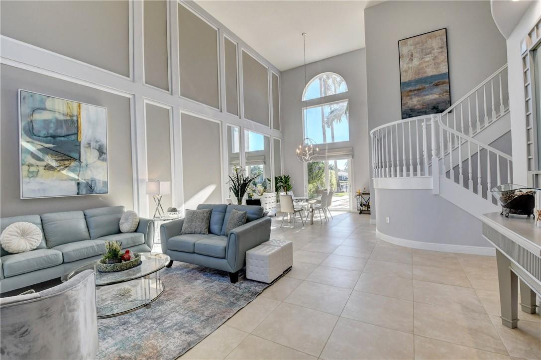 11750 Bayfield Drive Boca Raton, FL 33498 - Photo 16 of 70 a living room with furniture and a large window
