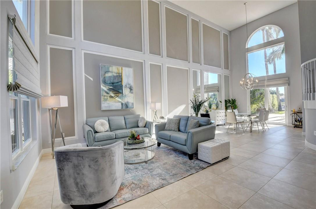 11750 Bayfield Drive Boca Raton, FL 33498 - Photo 17 of 70 a living room with furniture and a large window