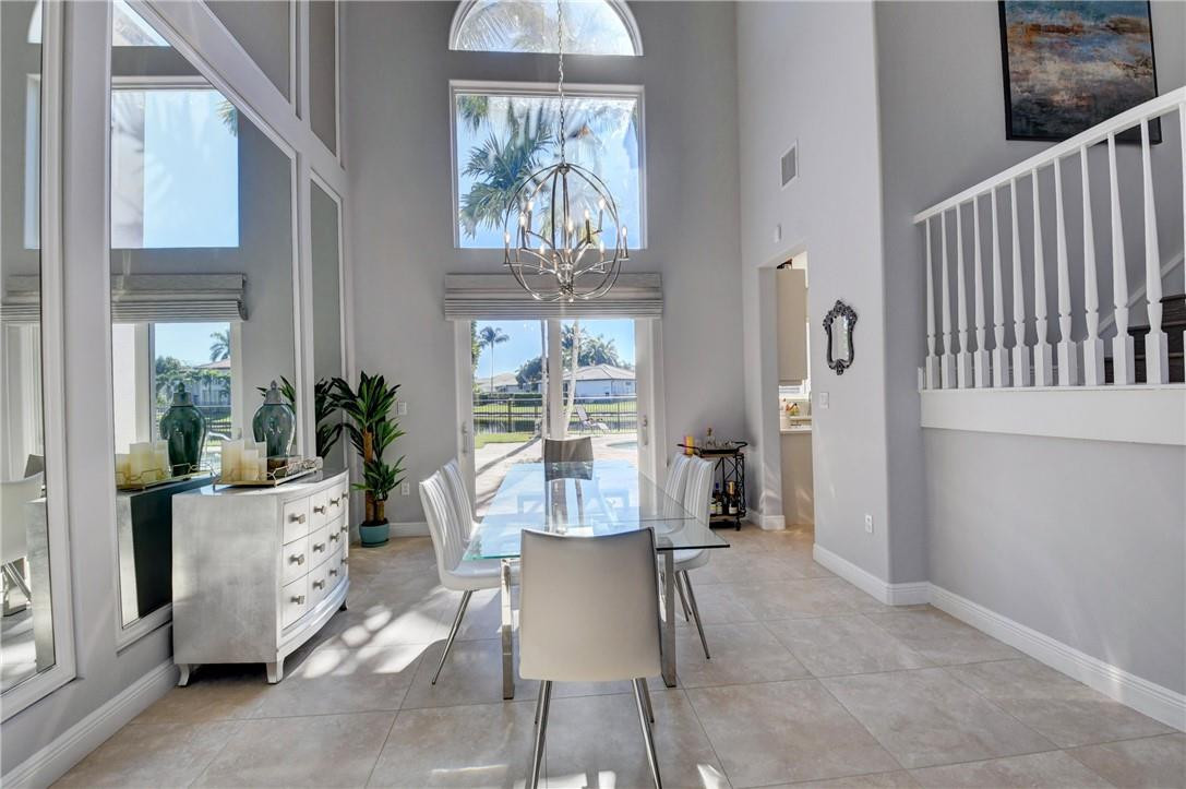 11750 Bayfield Drive Boca Raton, FL 33498 - Photo 21 of 70 a living room with furniture and a large window