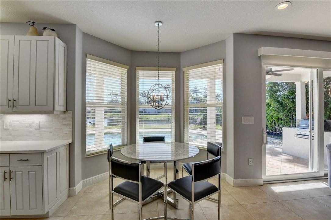 11750 Bayfield Drive Boca Raton, FL 33498 - Photo 31 of 70 a view of a dining room with furniture window and outside view