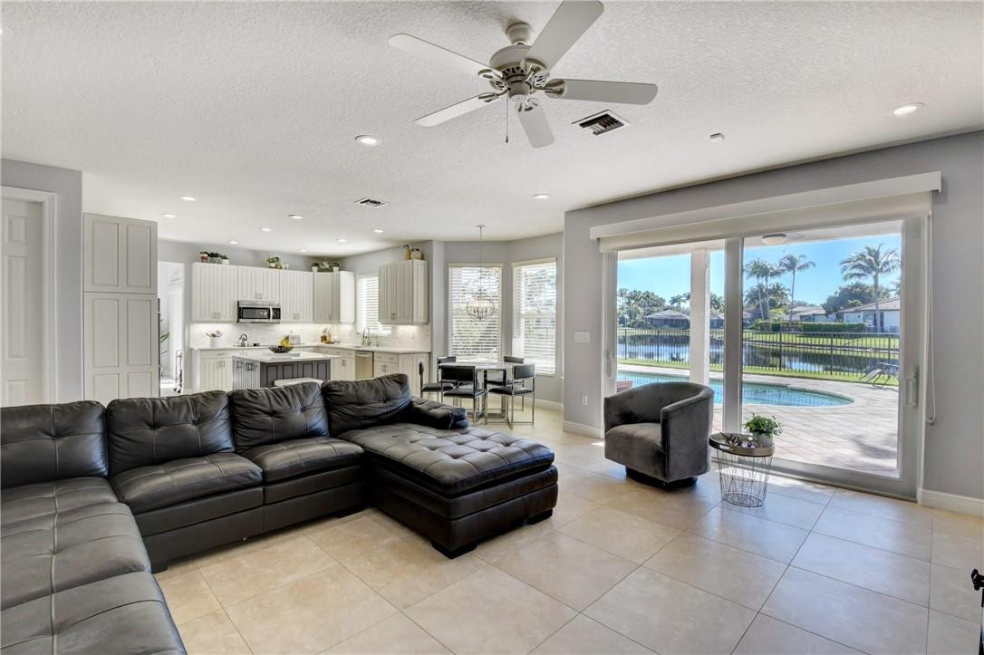 11750 Bayfield Drive Boca Raton, FL 33498 - Photo 34 of 70 a living room with furniture and a large window