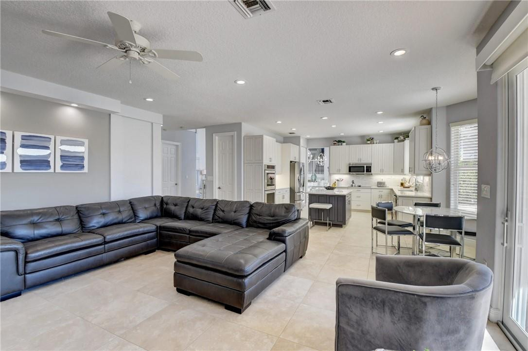 11750 Bayfield Drive Boca Raton, FL 33498 - Photo 35 of 70 a living room with furniture and a view of kitchen