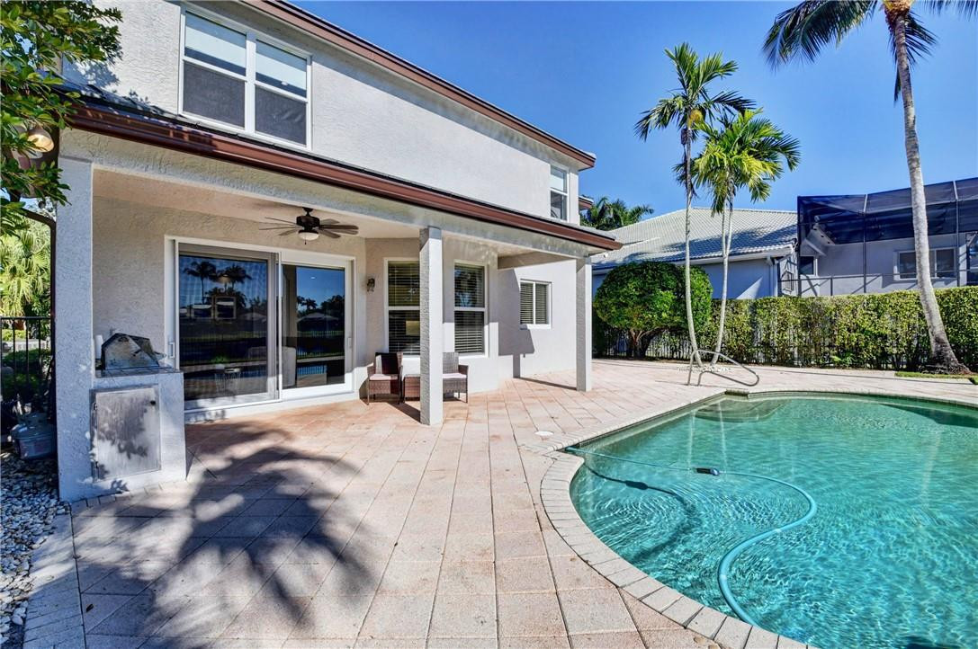 11750 Bayfield Drive Boca Raton, FL 33498 - Photo 40 of 70 a view of a house with backyard porch and sitting area