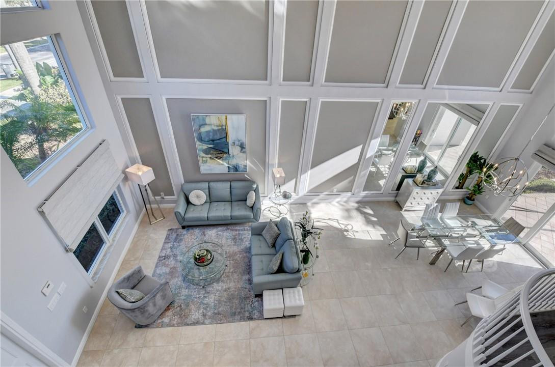 11750 Bayfield Drive Boca Raton, FL 33498 - Photo 49 of 70 a view of living room with furniture and a floor to ceiling window