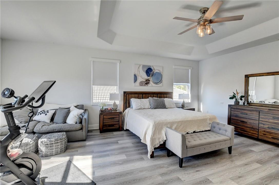 11750 Bayfield Drive Boca Raton, FL 33498 - Photo 54 of 70 a bedroom with furniture and a chandelier