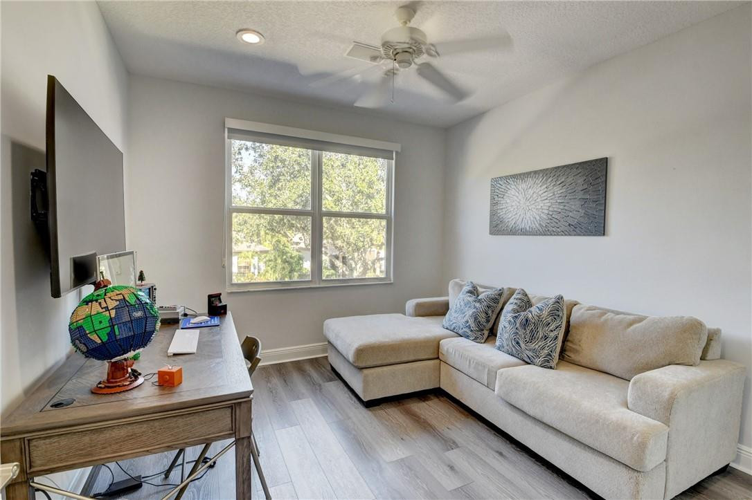 11750 Bayfield Drive Boca Raton, FL 33498 - Photo 59 of 70 a living room with furniture and a potted plant