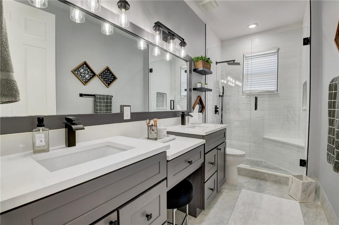 11750 Bayfield Drive Boca Raton, FL 33498 - Photo 60 of 70 a bathroom with a sink double vanity granite tub shower and a mirror