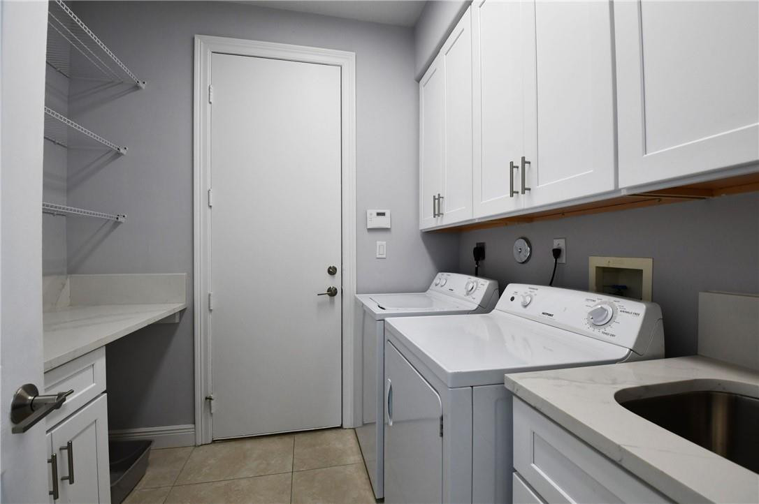11750 Bayfield Drive Boca Raton, FL 33498 - Photo 69 of 70 a utility room with dryer and washer