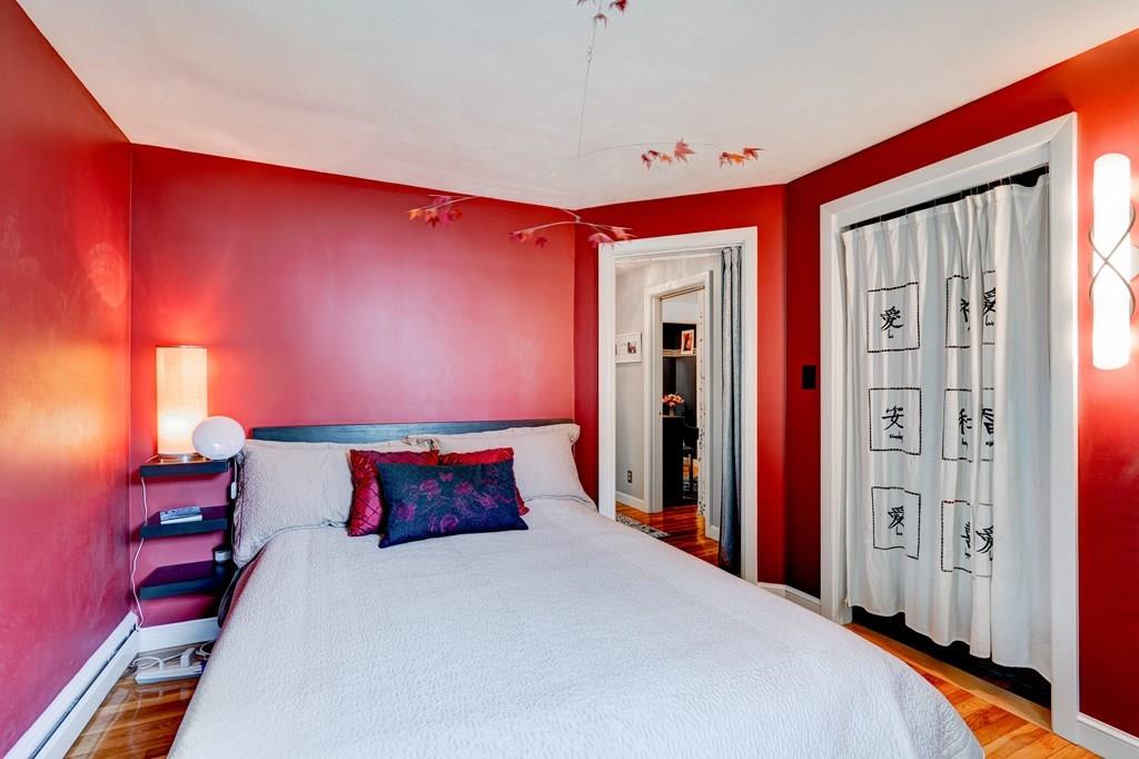 123 Harvard Road Littleton, MA 01460 - Photo 13 of 25 a large bed sitting in a bedroom next to a window