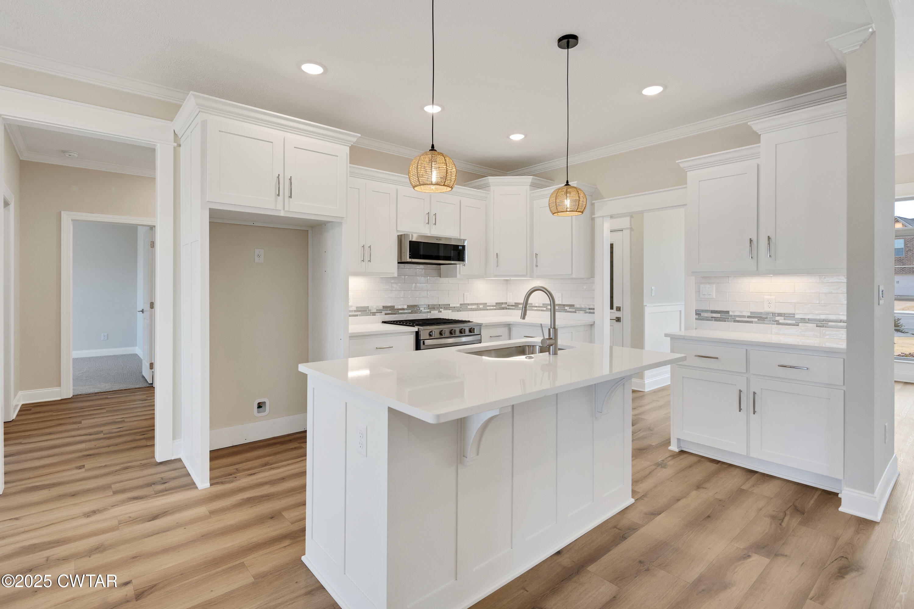 16 Enoch Cove Jackson, TN 38305 - Photo 12 of 28 a kitchen with kitchen island a sink stainless steel appliances and cabinets