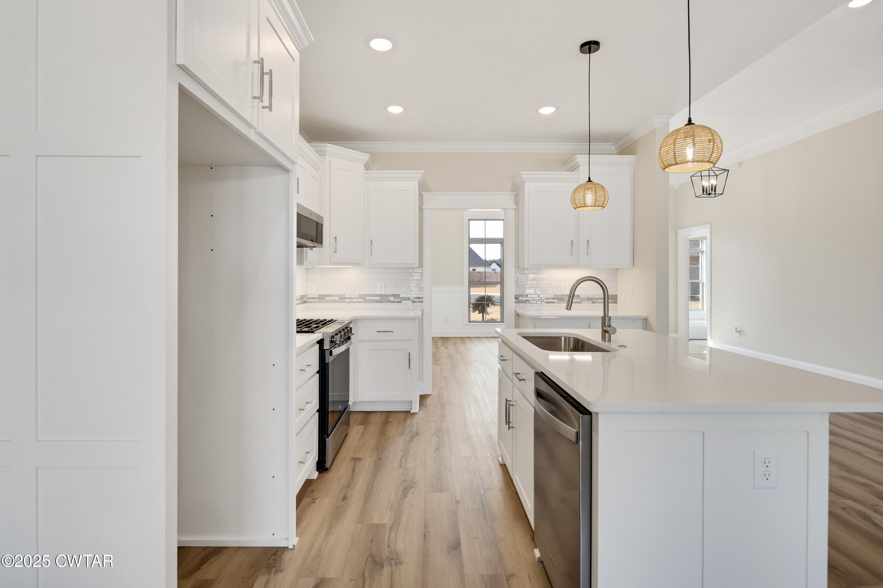 16 Enoch Cove Jackson, TN 38305 - Photo 13 of 28 a kitchen with counter top space a sink and appliances