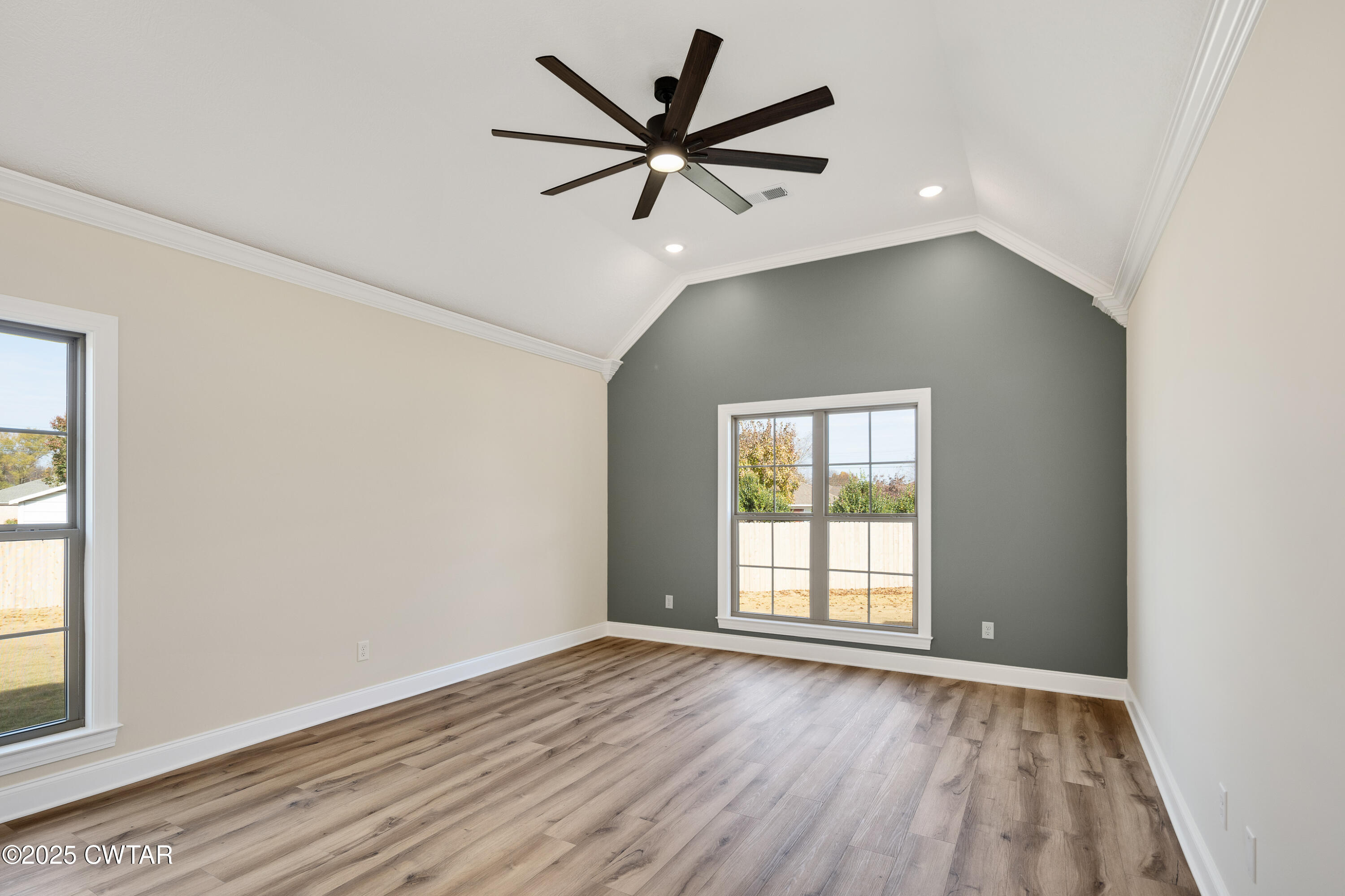 16 Enoch Cove Jackson, TN 38305 - Photo 14 of 28 an empty room with wooden floor fan and windows
