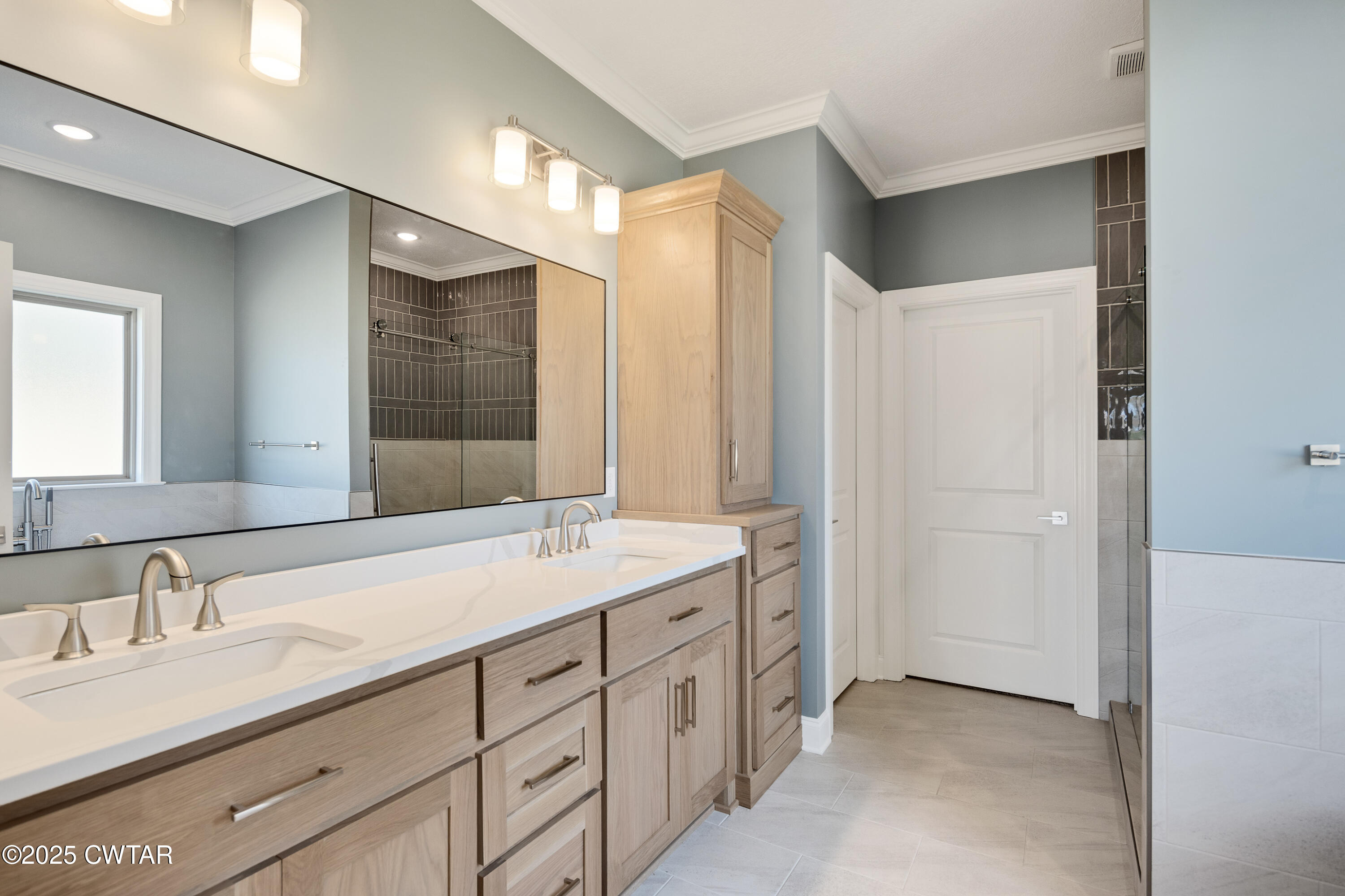 16 Enoch Cove Jackson, TN 38305 - Photo 16 of 28 a spacious bathroom with a double vanity sink mirror and double