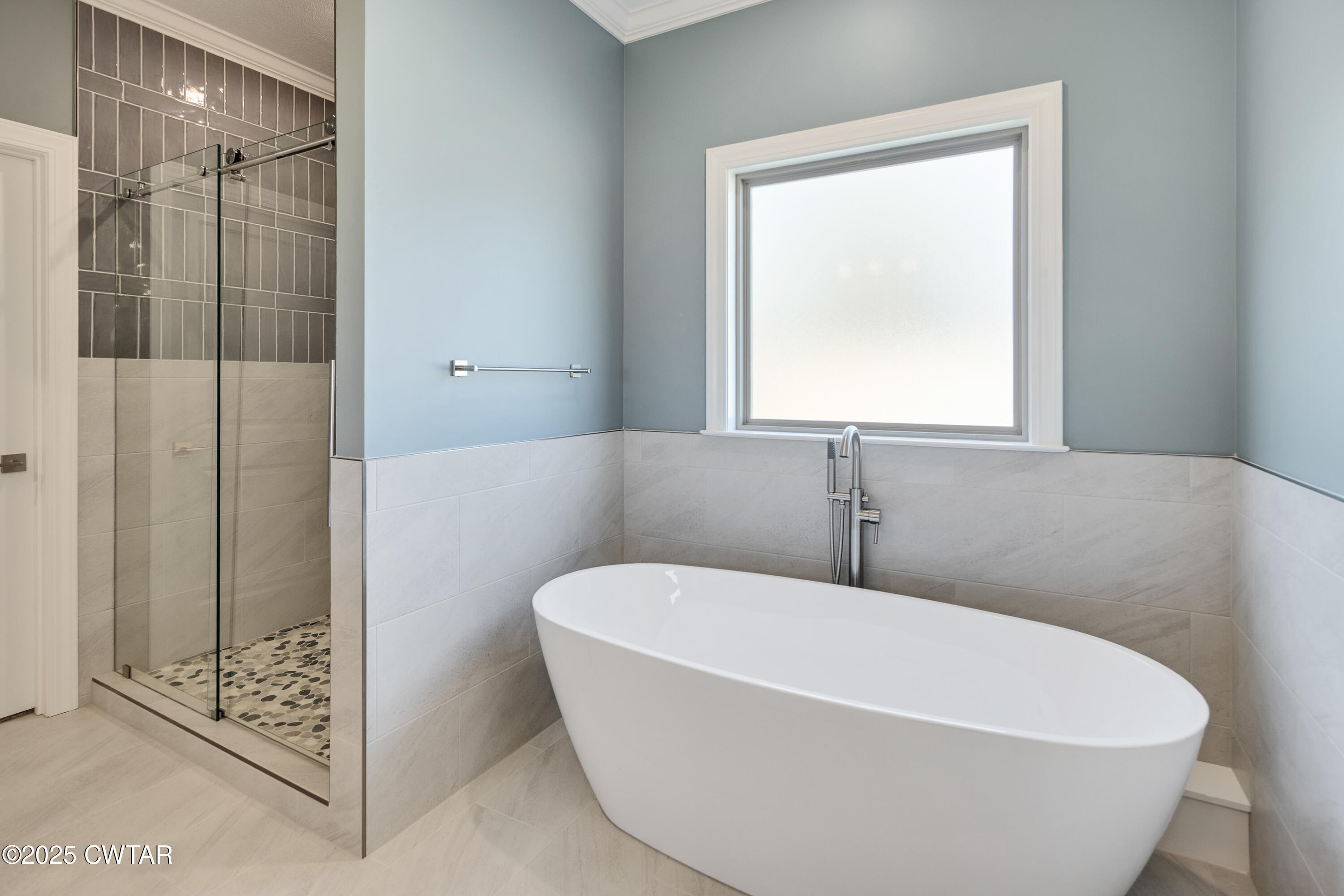 16 Enoch Cove Jackson, TN 38305 - Photo 17 of 28 a white bath tub sitting in a bathroom